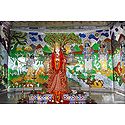Devi Sita with Ramayana Painting in the Background