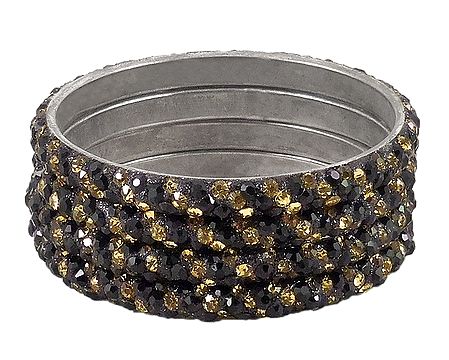 4 Black and Golden Stone Studded Metal Bangles