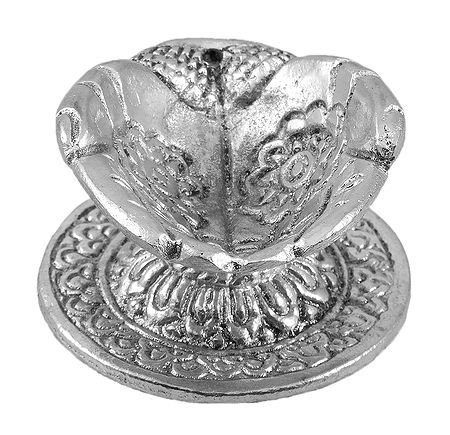 Oil Lamp on Metal Hand