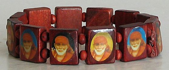 Buy/Send Sai Baba Rakhi & Free Chocolate Burfi Box Online- FNP