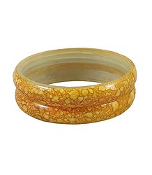 A Pair of Yellow Marble Print Acrylic Bangles