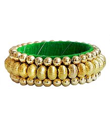 Golden Bead Bracelet with Green Cloth Lining
