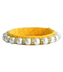 White Stone Studded and Faux Pearl Bead Bracelet with Yellow Cloth Lining
