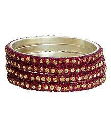 Four Red with Golden Stone Studded Bangles