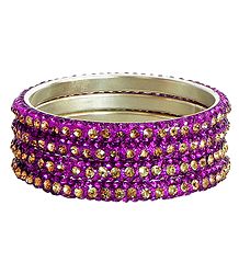 Four Magenta with Golden Stone Studded Bangles