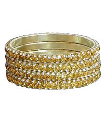 Four Golden with White Stone Studded Bangles