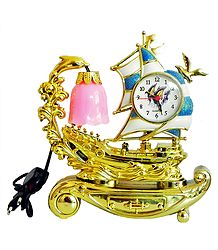 Battery Operated Table Clock in a Acrylic Sailing Ship with Lamp