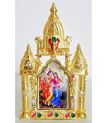 Radha Krishna on Stone Studded and Golden Carved Metal Frame