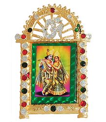 Radha Krishna on Stone Studded and Golden Carved Metal Frame - Table top Picture