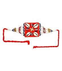 Multicolor Beaded Armlet with Cowrie on Saffron Cloth