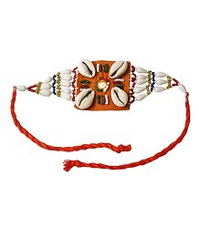 Multicolor Beaded Armlet with Cowrie on Saffron Cloth