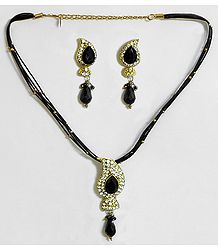 Black Corded Necklace with White and Black Stone Studded Pendant and Earrings