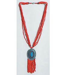 Dark Saffron Bead Necklace with Blue Beaded Metal Pendant
