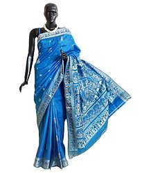 Cyan Blue Baluchari Silk Saree with All-Over Boota and Woven Wedding Scene on the Pallu and Border