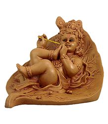 Krishna Resting on Leaf