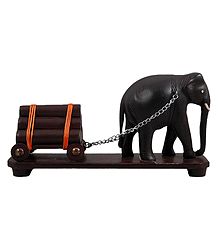 Elephant Carrying Logs
