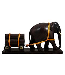 Elephant Carrying Logs